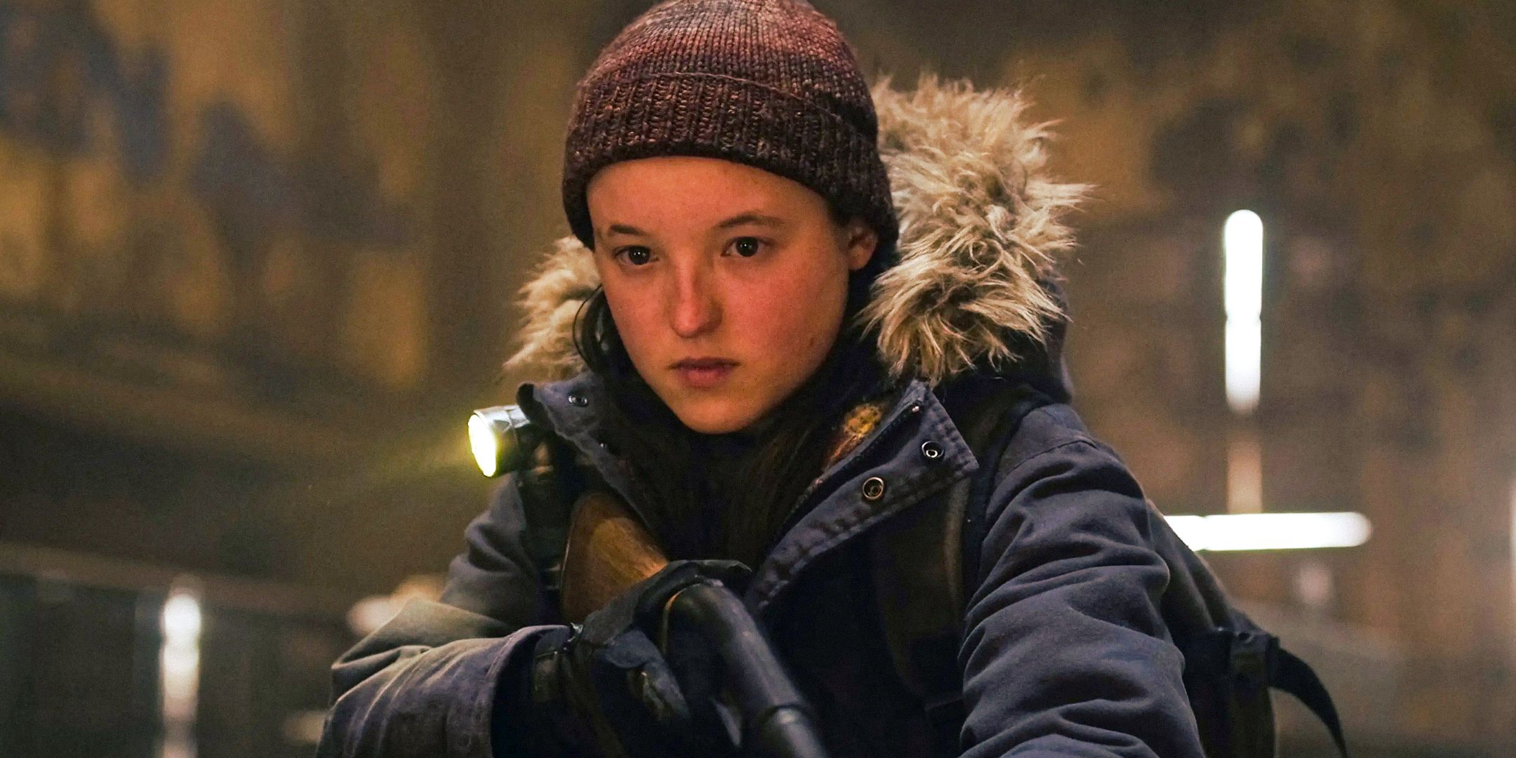 Ellie in The Last of Us HBO holding a shotgun.